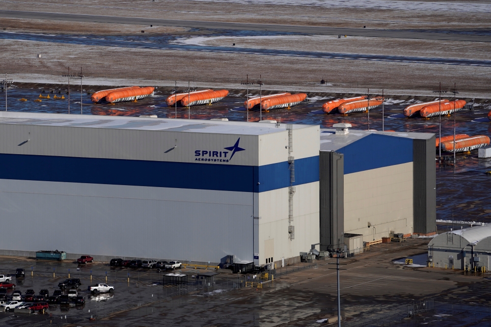 FILE PHOTO: Airplane fuselages bound for Boeing's 737 Max production facility sit in storage behind Spirit AeroSystems Holdings Inc headquarters, in Wichita, Kansas, U.S. December 17, 2019. REUTERS/Nick Oxford/File Photo