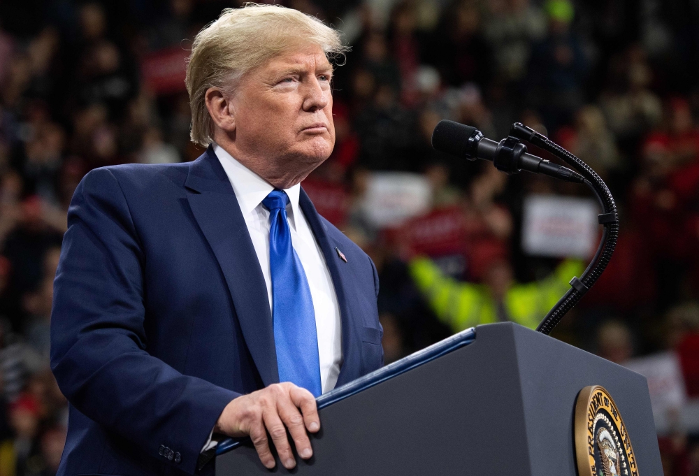 US President Donald Trump gestures as he speaks during a 