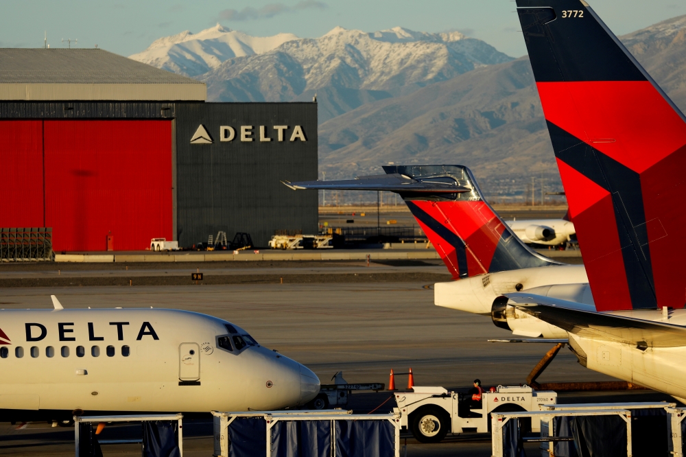 A Delta Air Lines flight is pushed put of its gate at the airport in Salt Lake City, Utah, U.S., January 12, 2018. REUTERS/Mike Blake/File Photo 