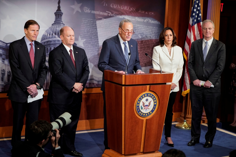 Senators Richard Blumenthal (D-CT), Chris Coons (D-DE), Senate Minority Leader Chuck Schumer (D-NY), Kamala Harris (D-CA) and Chris Van Hollen (D-MD) speak to journalists after the beginning of the impeachment trial of U.S. President Donald Trump on Capit