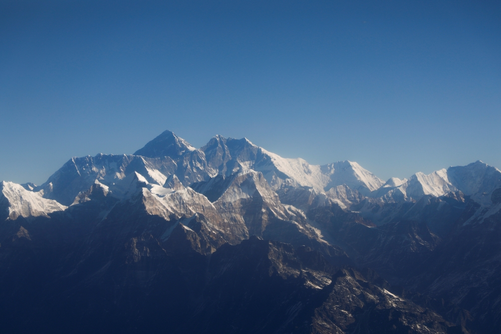 Mount Everest, the world highest peak, and other peaks of the Himalayan range are seen through an aircraft window during a mountain flight from Kathmandu, Nepal January 15, 2020. REUTERS/Monika Deupala
