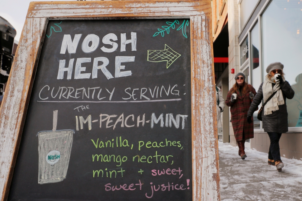 A cafe advertises an ‘Im-Peach-Mint’ drink, referring to the impeachment of US President Donald Trump, in Des Moines, Iowa, January 18, 2020. Reuters/Brian Snyder
 