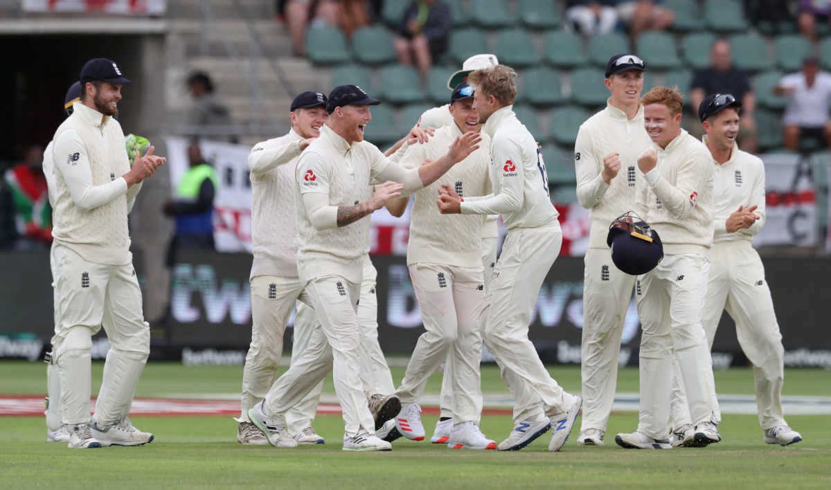 England's Joe Root celebrates taking the wicket of South Africa's Pieter Malan with teammates Reuters/Siphiwe Sibeko 
