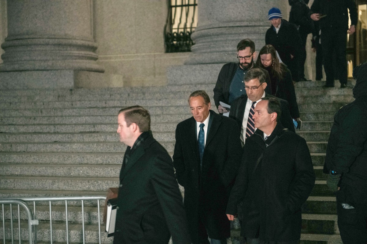 Former Republican New York Representative Chris Collins (2nd-L) leaves US District Court after being sentenced to 26 months in Federal prison on January 17, 2020 in New York City.  Scott Heins/Getty Images/AFP