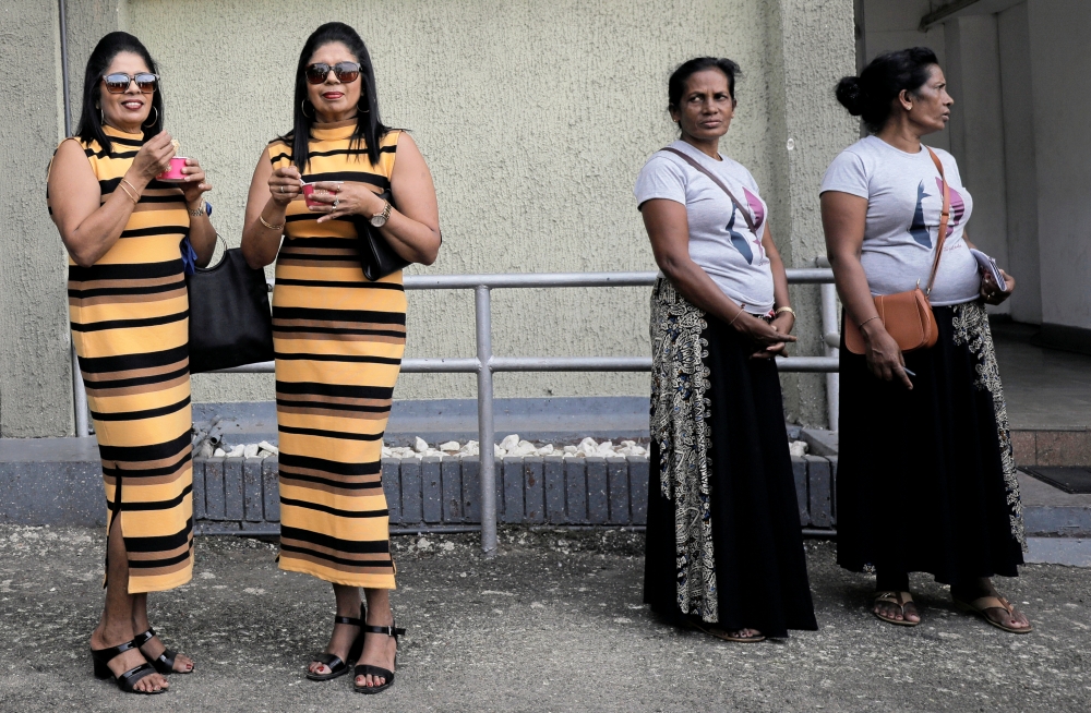 Lakshika and Devika (55), look on during an event to attempt to break the world record for the biggest gathering of twins in Colombo, Sri Lanka January 20, 2020. Reuters/Dinuka Liyanawatte
 
 