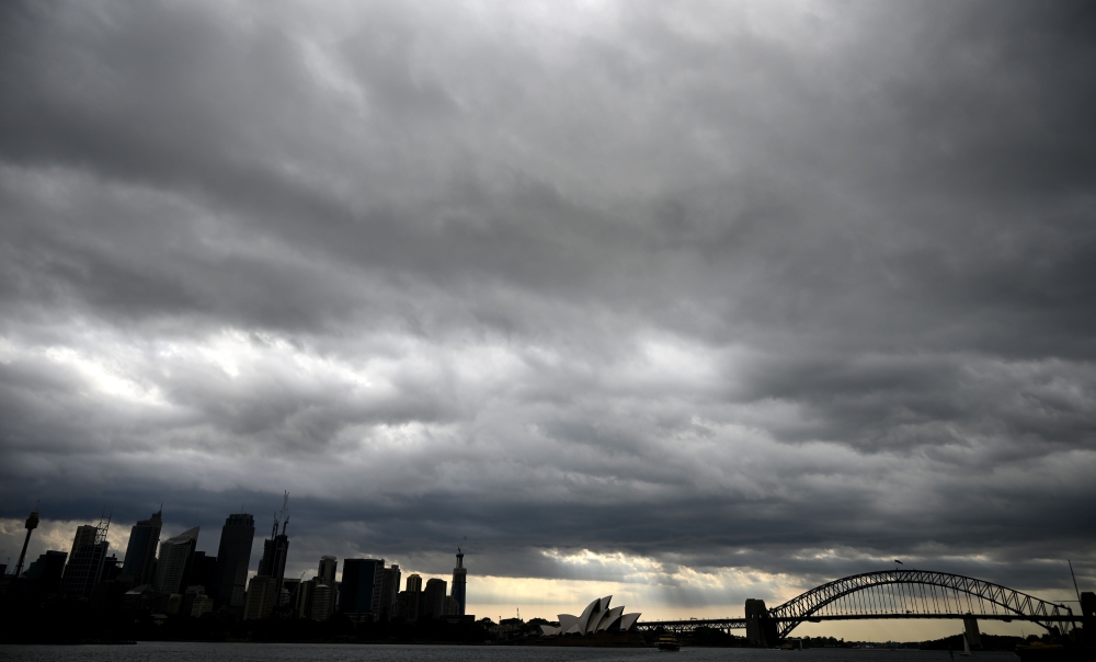 Storm clouds gather over Sydney Harbour on January 20, 2020.  AFP / Peter Parks 