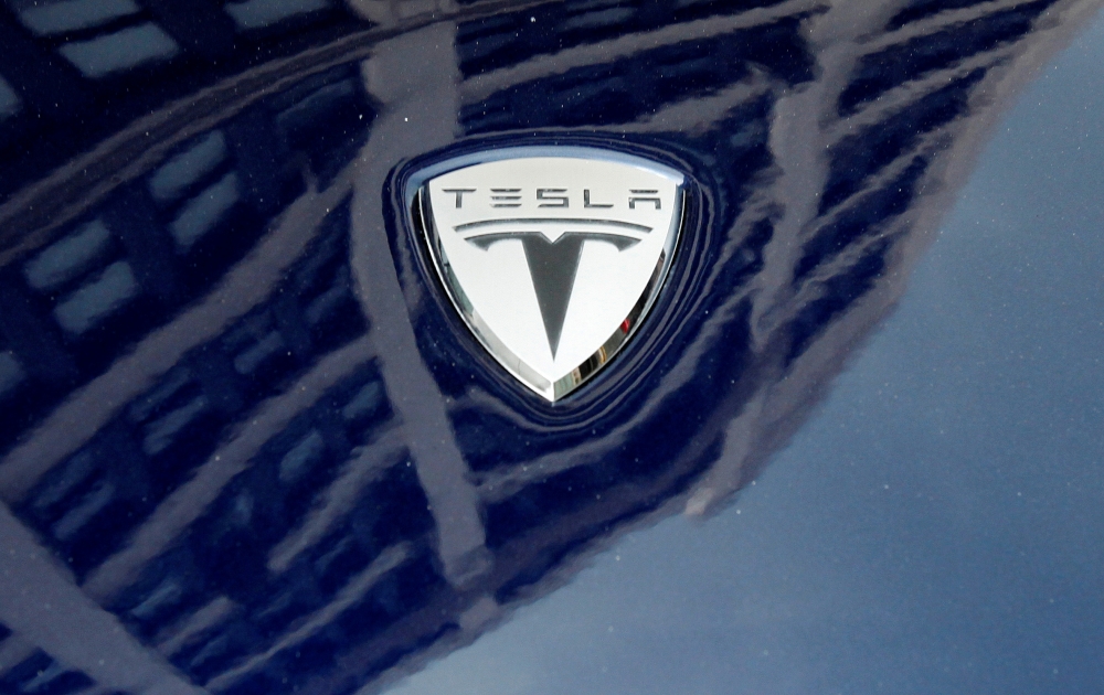 A logo of Tesla Motors on an electric car model is seen outside a showroom in New York, June 28, 2010. Reuters / Shannon Stapleton