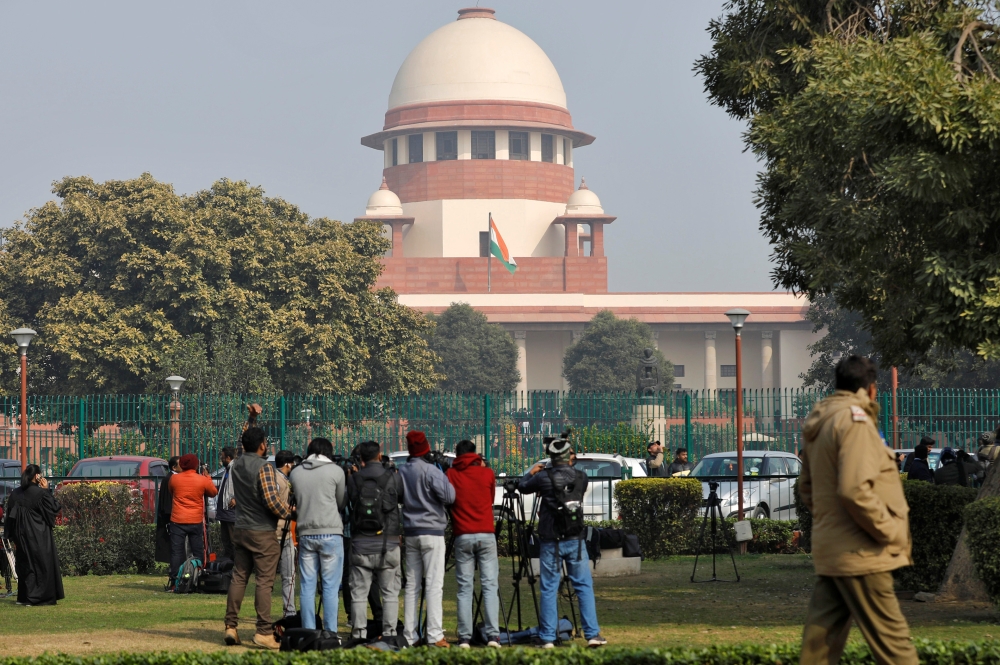 Television journalists are seen outside the premises of the Supreme Court in New Delhi, India, January 22, 2020. REUTERS/Anushree Fadnavis