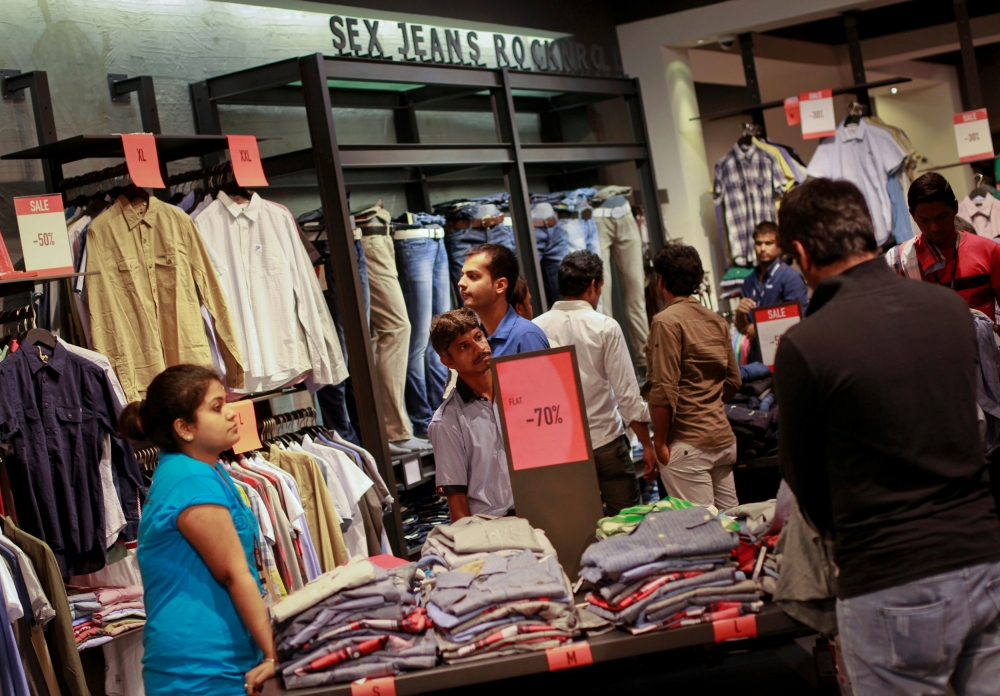  People shop for clothes during a seasonal sale at a store inside a shopping mall in Mumbai, India, July 14, 2012. Reuters/Danish Siddiqui