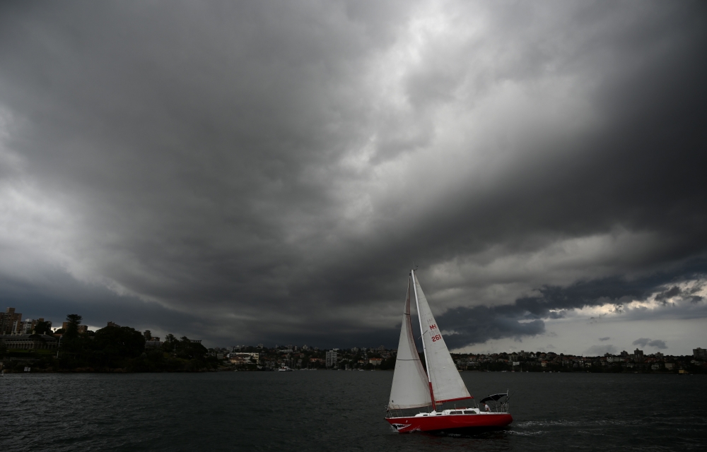 Storm clouds gather over Sydney Harbour on January 20, 2020. AFP / Peter Parks 