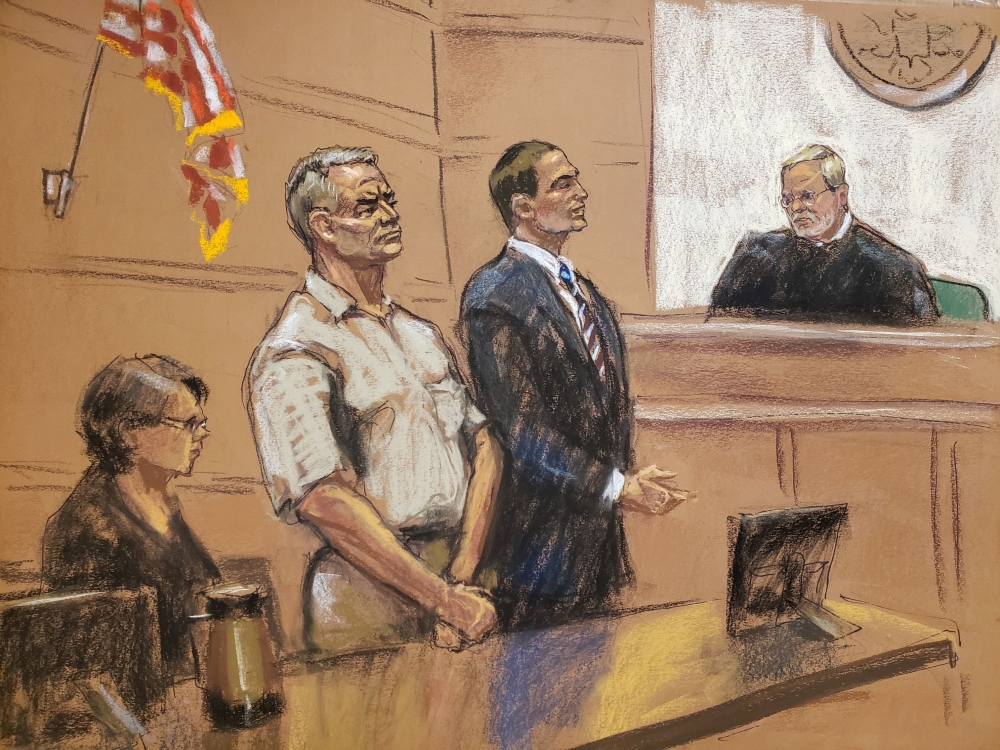 Genaro Garcia Luna stands beside his lawyer Cesar de Castro in front of Judge Brian Cogan as he appears on charges he accepted millions of dollars in bribes to protect the Sinaloa drug cartel once run by Joaquin 