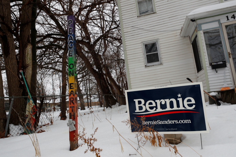 A campaign sign for Democratic 2020 U.S. presidential candidate and U.S. Senator Bernie Sanders sits outside a home in Des Moines, Iowa, U.S., January 23, 2020. REUTERS/Shannon Stapleton