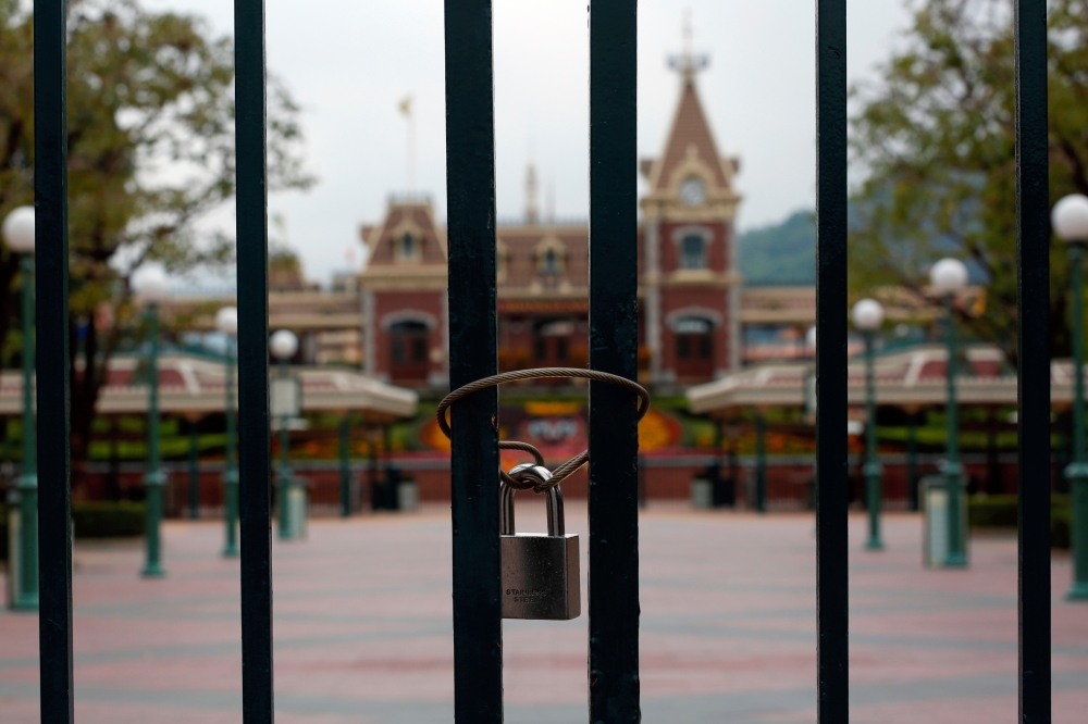 A locked gate is seen after the Hong Kong Disneyland theme park has been closed, following the coronavirus outbreak in Hong Kong, China January 26, 2020. REUTERS/Tyrone Siu