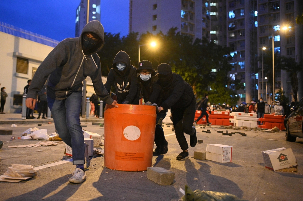 Residents set up barricades near the vacant Fai Ming Estate to protest against plans for the estate to be used as a quarantine camp for patients and frontline medical staff of a coronavirus outbreak which began in the Chinese city of Wuhan, in the Fanling