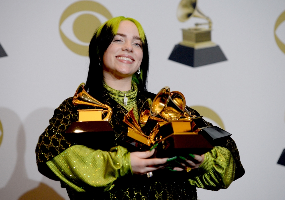 US singer-songwriter Billie Eilish poses in the press room with the awards for Album Of The Year, Record Of The Year, Best New Artist, Song Of The Year and Best Pop Vocal Album during the 62nd Annual Grammy Awards on January 26, 2020, in Los Angeles. / AF