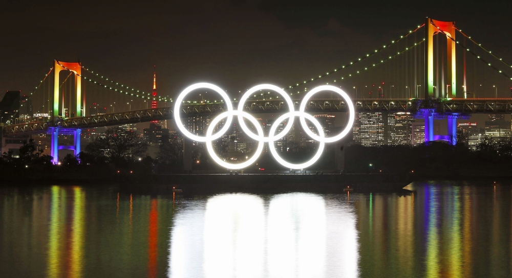Fireworks light up the sky near the illuminated Olympic rings at a ceremony to mark six months before the start of the 2020 Olympic Games in Tokyo, Japan in this photo taken by Kyodo January 24, 2020. Mandatory credit Kyodo/via REUTERS 