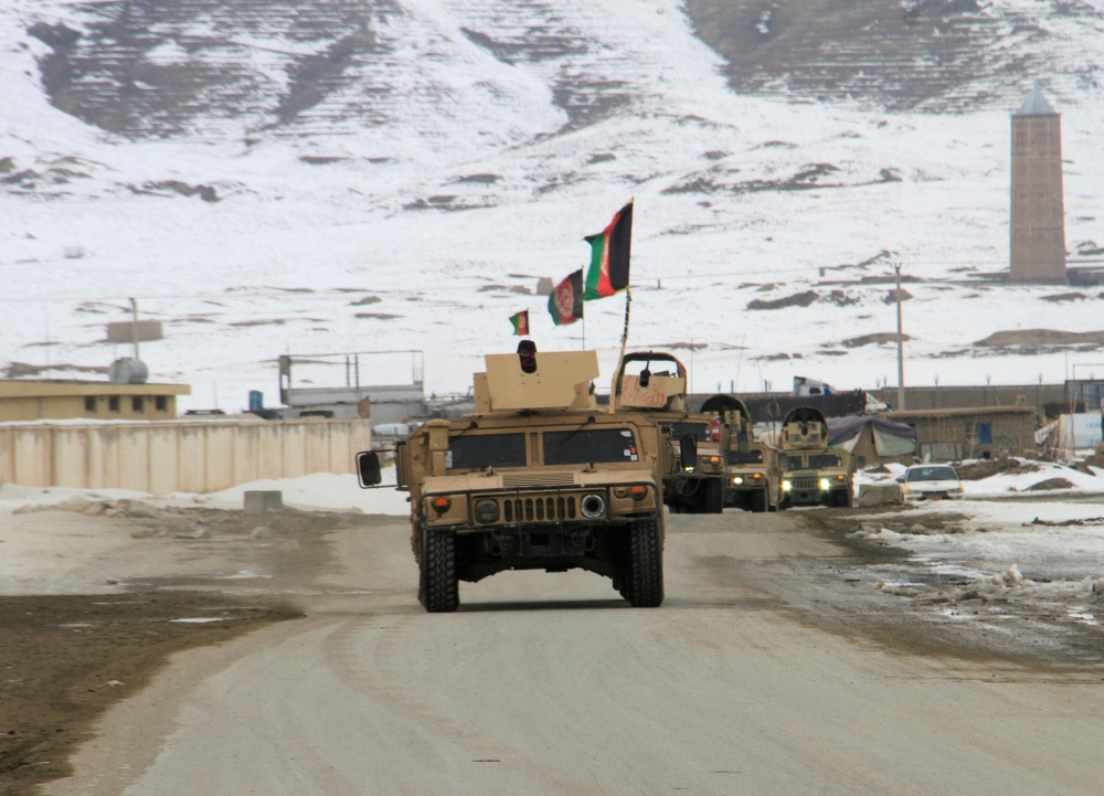 Afghan National Army forces go towards the site of an aeroplane crash in Deh Yak district of Ghazni province, Afghanistan January 27, 2020. REUTERS/Mustafa Andaleb