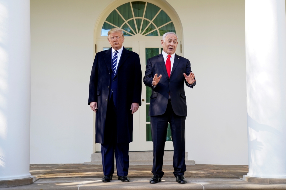U.S. President Donald Trump listens as he welcomes Israel's Prime Minister Benjamin Netanyahu at the White House in Washington, U.S., January 27, 2020. REUTERS/Kevin Lamarque