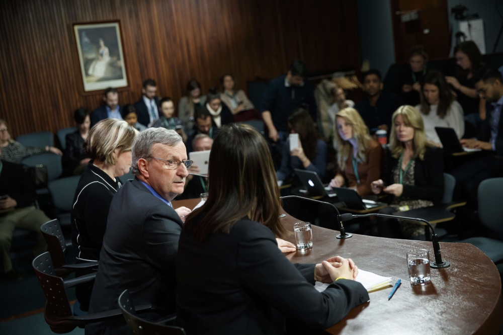 Dr. David Williams, the Chief Medical Officer of Ontario looks over at Dr. Eileen de Villa, Medical Officer of Health for the City of Toronto, during a press briefing on the coronavirus at Queens Park on January 27, 2020 in Toronto, Canada. (Cole Burston/