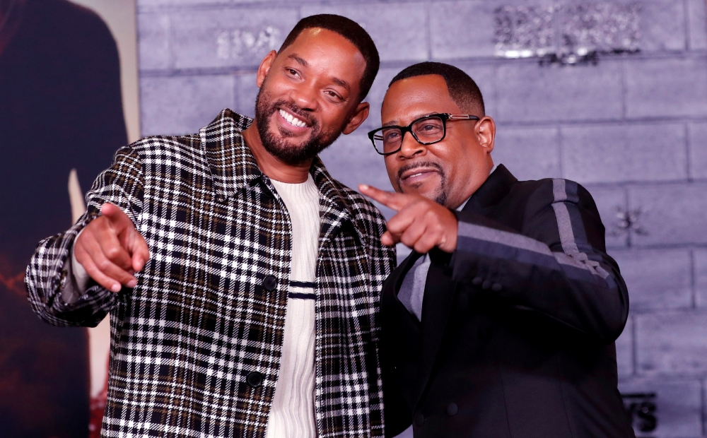 FILE PHOTO: Cast members Will Smith (L) and Martin Lawrence pose at the premiere of