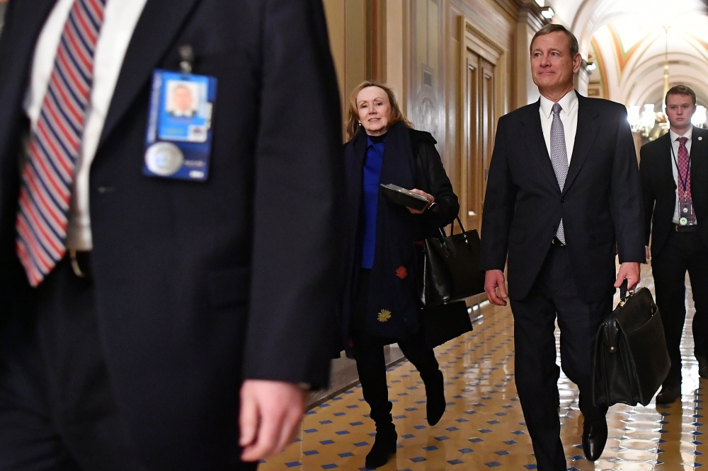 US Supreme Court Chief Justice John Roberts departs the Senate chamber after the impeachment trial of US President Donald Trump at the US Capitol in Washington, DC on January 27, 2020. AFP / Mandel Ngan 