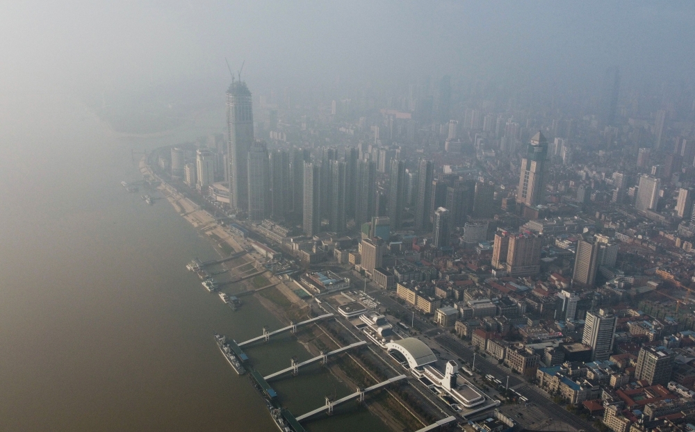 An aerial view shows residential and commercial buildings of Wuhan in China's central Hubei province on January 27, 2020, amid a deadly virus outbreak in the city. AFP / Hector RETAMAL