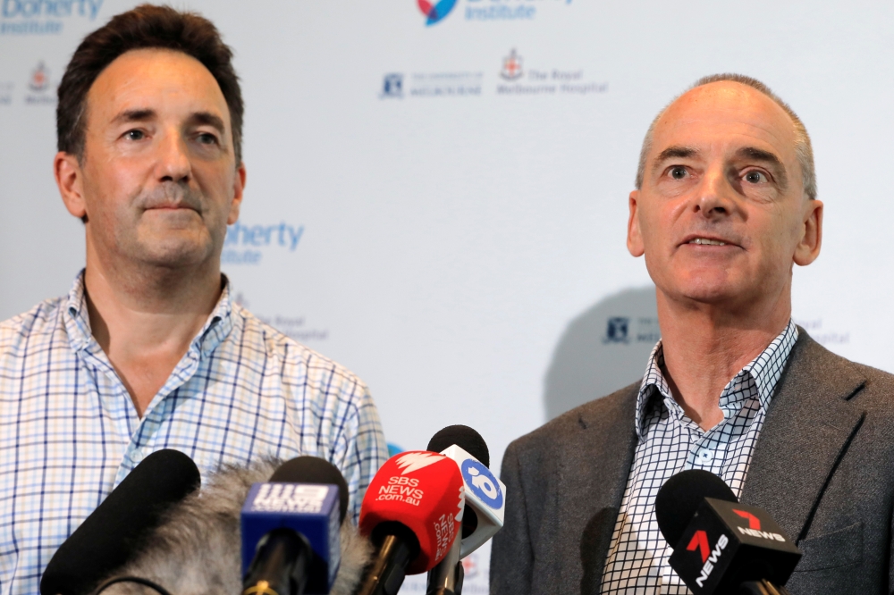 (L-R) The Royal Melbourne Hospital's Dr Julian Druce, Virus Identification Laboratory Head at the Doherty Institute and Dr Mike Catton, Deputy Director of the Doherty Institute address media to announce having successfully grown the Wuhan coronavirus from