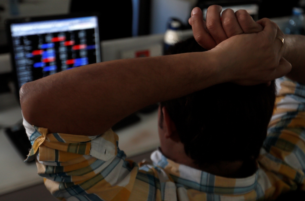 A broker reacts while trading at his computer terminal at a stock brokerage firm in Mumbai, India, February 1, 2020. (REUTERS/Francis Mascarenhas)