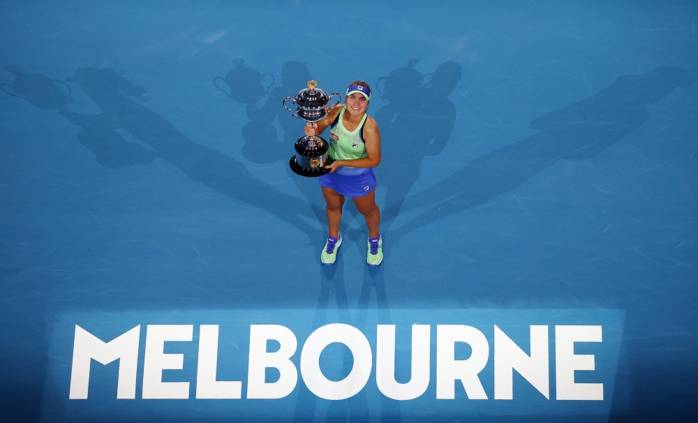 Sofia Kenin of the U.S. celebrates with the trophy after winning her match against Spain's Garbine Muguruza REUTERS/Kai Pfaffenbach