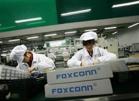 Employees work inside a Foxconn factory in the township of Longhua in the southern Guangdong province, China in this May 26, 2010 file photo. Reuters / Bobby Yip