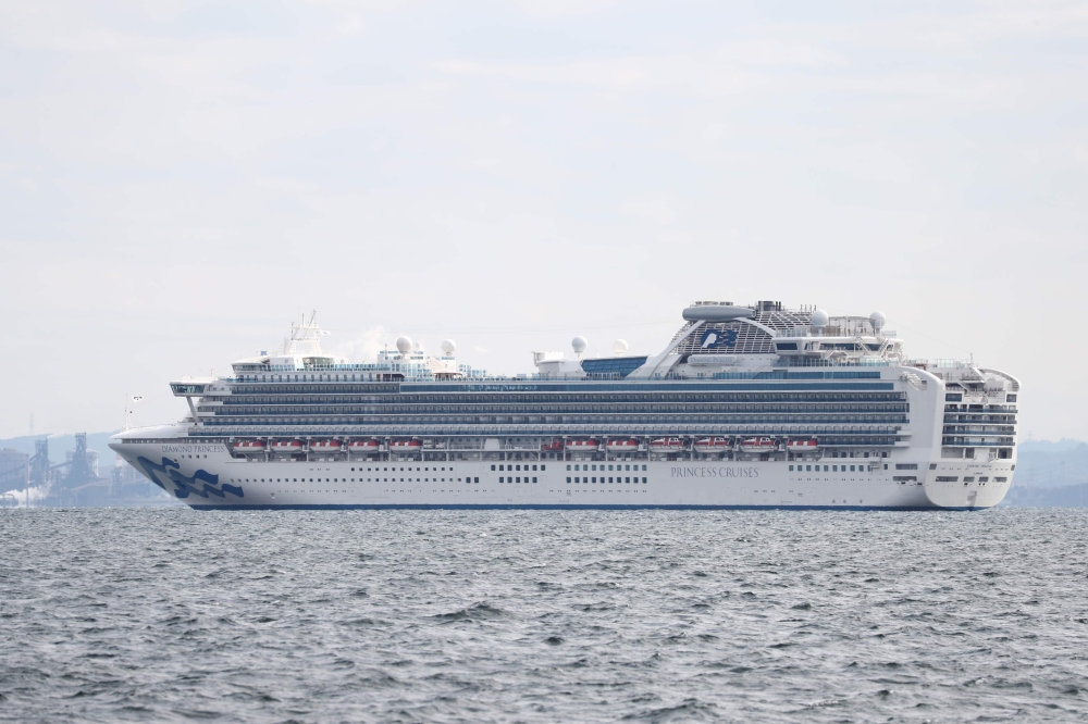 The Diamond Princess cruise ship with over 3,000 people sits anchored in quarantine off the port of Yokohama on February 4, 2020, a day after it arrived with passengers feeling ill. Japan has quarantined the cruise ship carrying 3,711 people and was testi