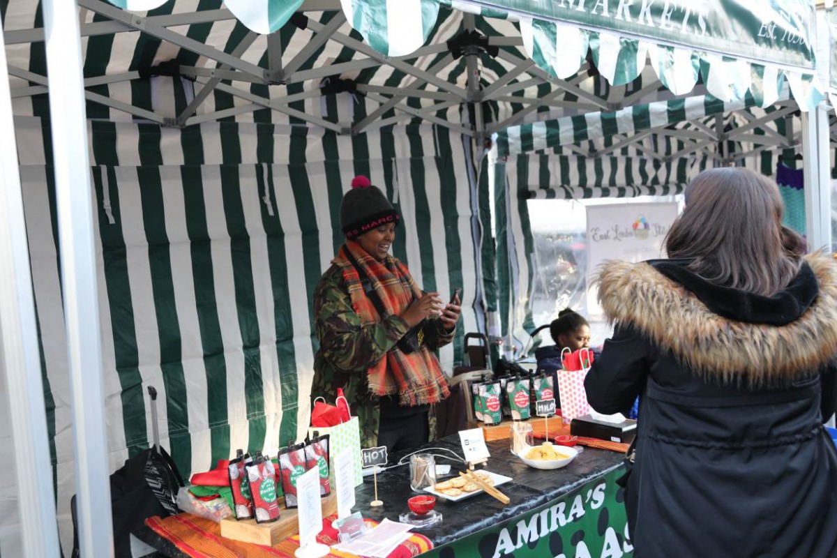 Market trader Amiira Ismail sells her Somali-inspired hot sauce at the 