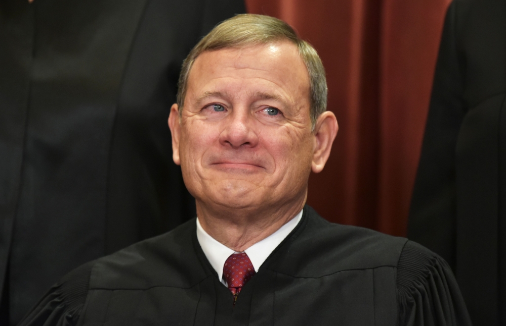 In this file photo taken on November 30, 2018 Chief Justice John Roberts poses for the official group photo at the US Supreme Court in Washington, DC. AFP / Mandel Ngan