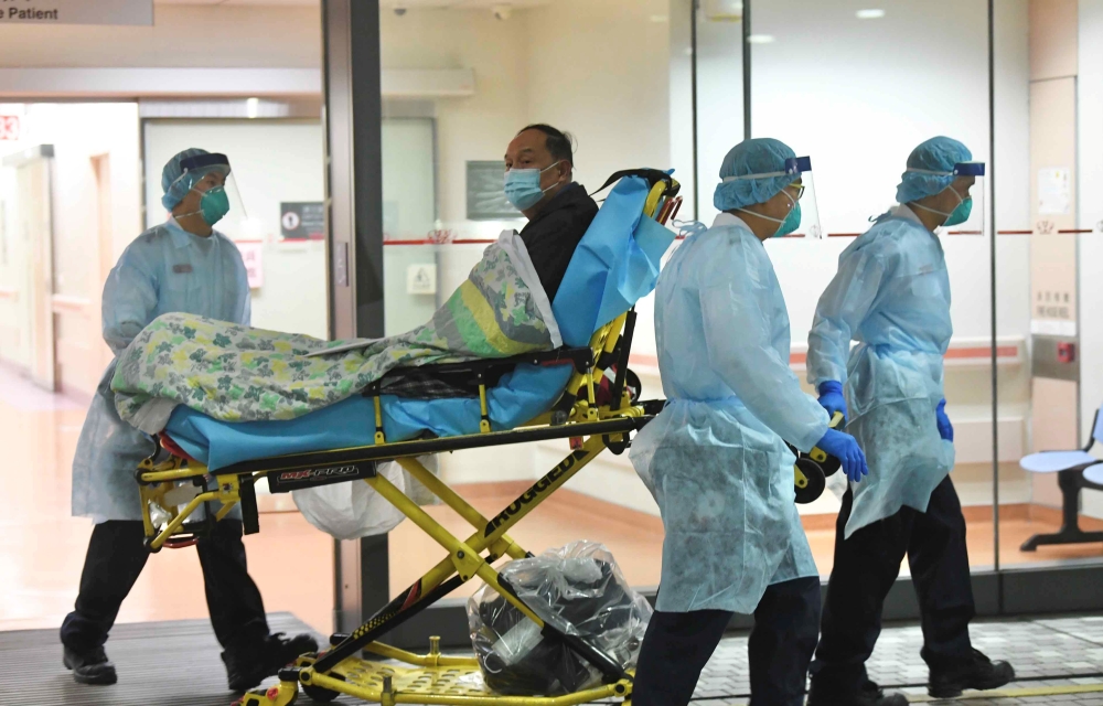 Medical staff transfer a patient of a suspected case of a new coronavirus at the Prince of Wales Hospital in Hong Kong, January 22, 2020. (cnsphoto via Reuters)