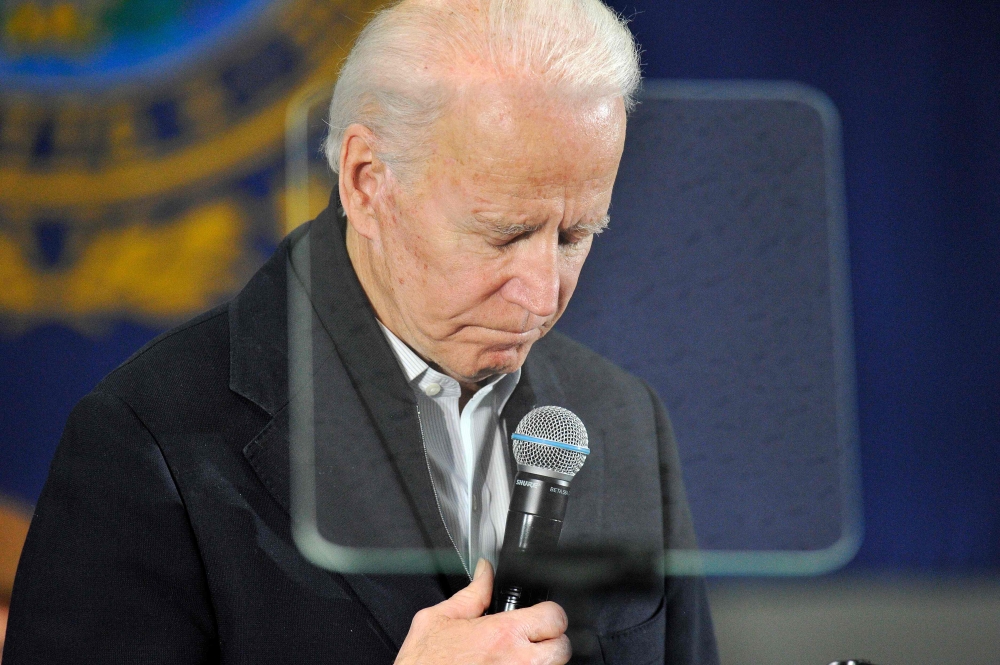Joe Biden gestures as he addresses supporters and curious voters at the IBEW Local 490 in Concord, New Hampshire on February 4, 2020. AFP / Joseph Prezioso 