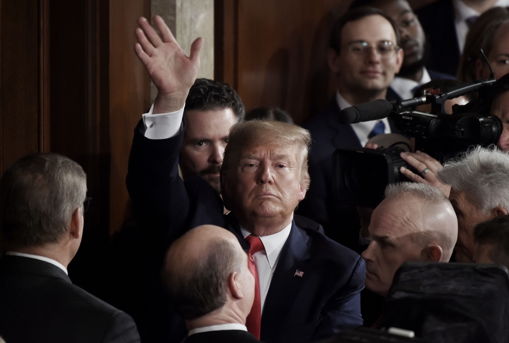 President Donald Trump waves after delivering his State of the Union address in the chamber of the US House of Representatives at the US Capitol Building on February 4, 2020. AFP / Olivier Douliery
 
 