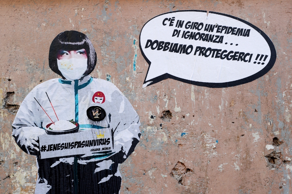 A mural against xenophobia towards Chinese people is seen after two cases of the novel coronavirus were confirmed in Italy, by street artist Laika in Rome, Italy, February 5, 2020. Reuters/Guglielmo Mangiapane