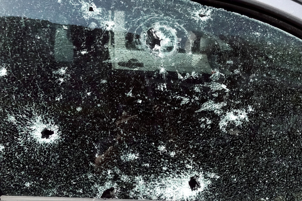 Bullet holes are pictured on the window of a victim's car following a gun battle involving a Thai soldier on a shooting rampage, in Nakhon Ratchasima, Thailand, February 9, 2020. Reuters/Athit Perawongmetha