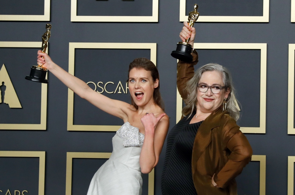 Elena Andreicheva and Carol Dysinger pose with the Oscar for Best documentary Short Subject for 
