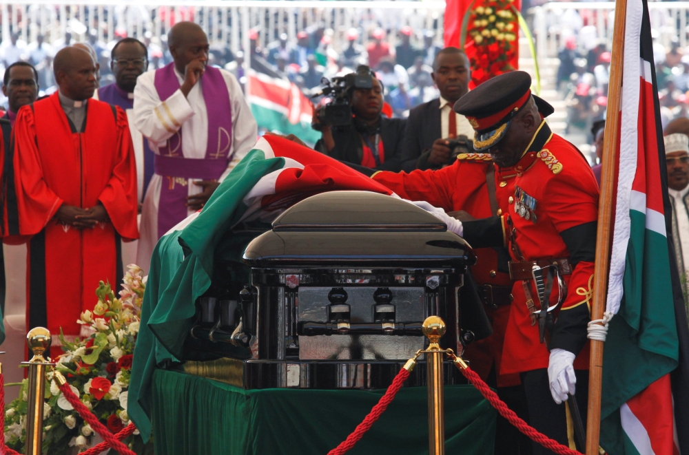  Military officers prepare the coffin of late former Kenya's President Daniel Arap Moi draped in the national flag during a memorial service at the Nyayo Stadium in Nairobi, Kenya February 11, 2020. REUTERS/Njeri Mwangi 