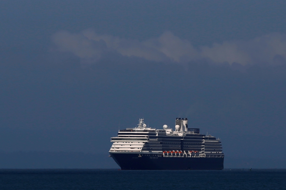 MS Westerdam, a cruise ship that has been turned away by five countries over fears that someone aboard may have the coronavirus, is seen arriving in Sihanoukville port in Cambodia February 13, 2020. REUTERS/Stringer