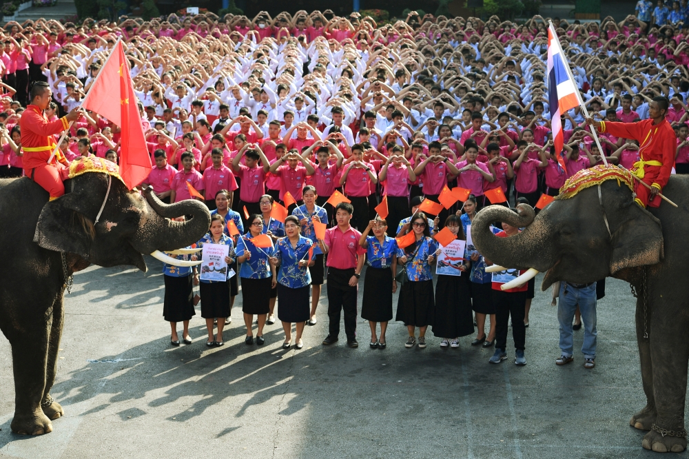 Elephants join Thai students as they form a heart shape on Valentine's Day to show their support for China in the fight against coronavirus at a school in Ayutthaya, outside Bangkok, Thailand February 14, 2020. REUTERS/Chalinee Thirasupa