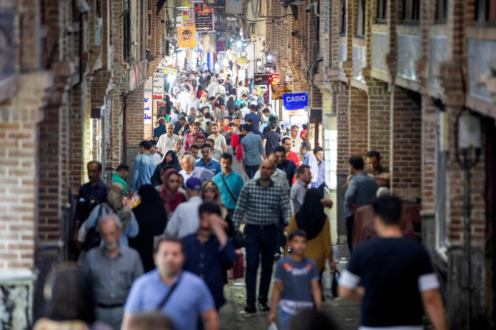 FILE PHOTO: People shop in a shopping street called Grand Bazaar in downtown Tehran, Iran June 23, 2019. Nazanin Tabatabaee/Wana News agency/via Reuters 