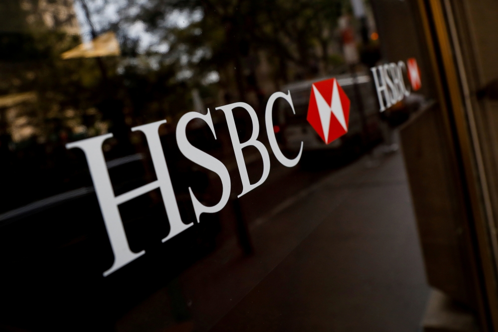 FILE PHOTO: HSBC logos are seen on a branch bank in the financial district in New York, U.S., August 7, 2019. REUTERS/Brendan McDermid/File Photo