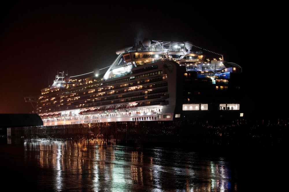 Diamond Princess cruise ship, with people, quarantined onboard due to fears of the new COVID-19 coronavirus, is docked at the Daikaku Pier Cruise Terminal in Yokohama port on February 16, 2020. AFP / Behrouz Mehri 