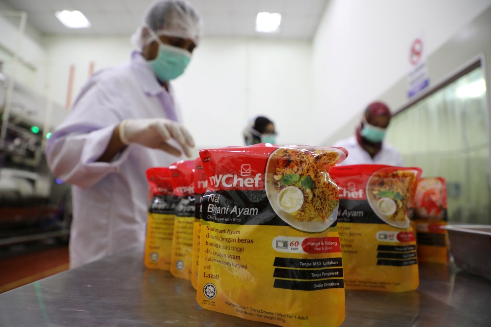 Workers arrange food packages at Mychef halal food factory in Kuala Lumpur, Malaysia, December 6, 2019. Picture taken December 6, 2019. REUTERS/Lim Huey Teng