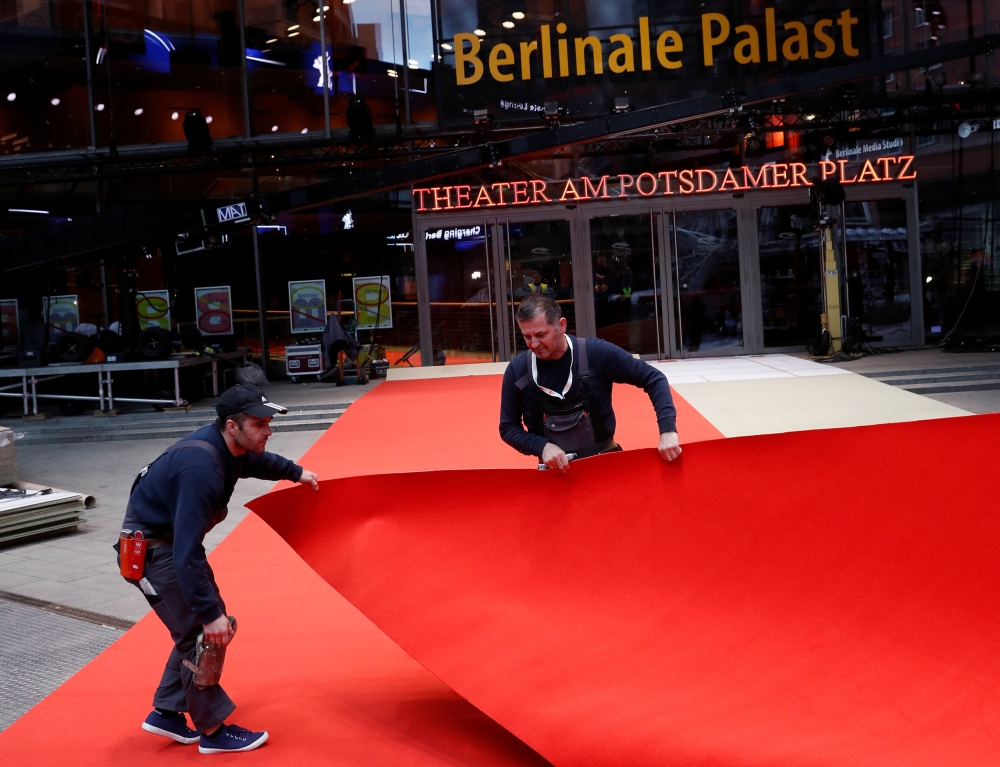 Workers lay the red carpet for the upcoming Berlinale Film Festival in Berlin, Germany February 18, 2020. Reuters/Michele Tantussi