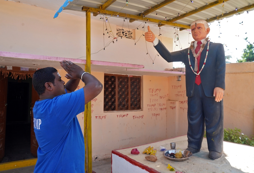 Bussa Krishna, a fan of U.S. President Donald Trump, offers prayers to a statue of Trump at his house in Konney village in the southern state of Telangana, India, February 14, 2020. Picture taken February 14, 2020. REUTERS/Vinod Babu