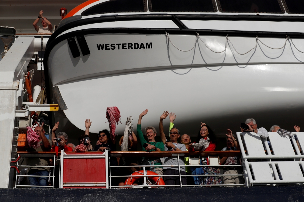 Passengers onboard MS Westerdam, a cruise ship that spent two weeks at sea after being turned away by five countries over fears that someone aboard might have the coronavirus, are seen in Sihanoukville, Cambodia February 14, 2020. REUTERS/Soe Zeya Tun/Fil