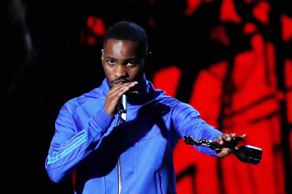 British rapper Dave collects his award for Album of the Year for 'Psychodrama' during the BRIT Awards 2020 ceremony and live show in London on February 18, 2020. / AFP / Adrian DENNIS /